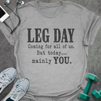 Sport grey T-shirt printed with "LEG DAY Coming for all of us. But today... mainly YOU." in brown