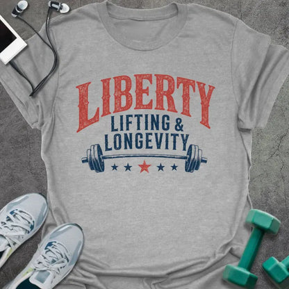 Sport grey t-shirt printed with "Liberty Lifting & Longevity" in blue and red, with a barbell and stars