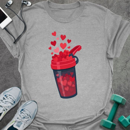 Sport grey t-shirt with a protein shake container overflowing with hearts in red, blue, white, pink