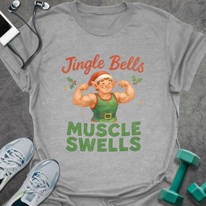 Sport grey t-shirt printed with "Jingle Bells MUSCLE SWELLS" in red and green, with an illustration of a leprechaun flexing