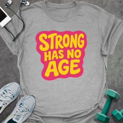 Sport grey t-shirt printed with "STRONG HAS NO AGE" in yellow and pink, with badge graphic