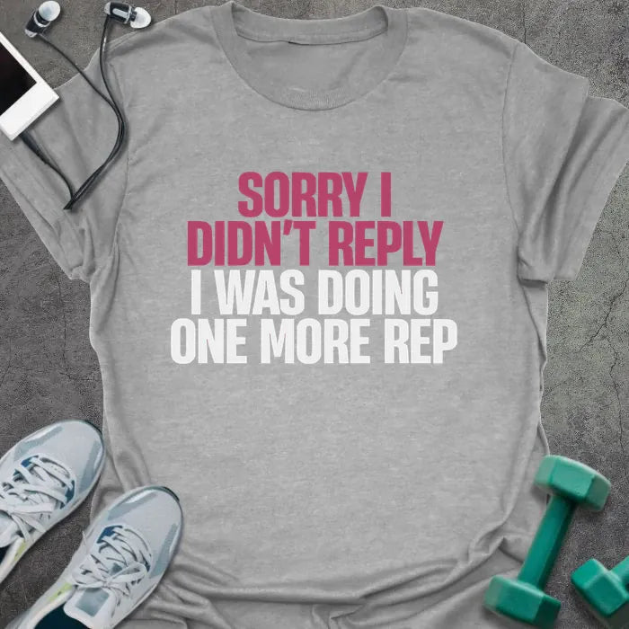 Sport grey t-shirt printed with "Sorry I Didn't Reply I Was Doing One More Rep" in white and pink