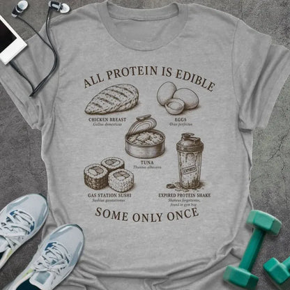 Sport Grey t-shirt printed with "ALL PROTEIN IS EDIBLE" in black text with sepia-tone engraving style illustrations and 'SOME ONLY ONCE' at bottom