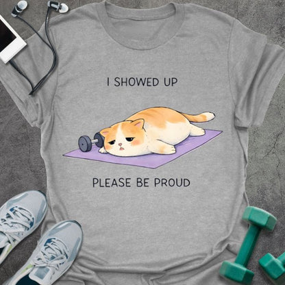 Sport grey t-shirt printed with "I Showed Up Please Be Proud" in orange, white, purple, with an orange and white cat on a purple yoga mat