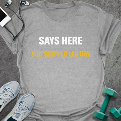 Sport grey t-shirt printed with "Says Here You Skipped Leg Day" in white, orange