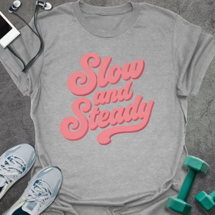 Sport grey t-shirt printed with "Slow and Steady" in rose and pink