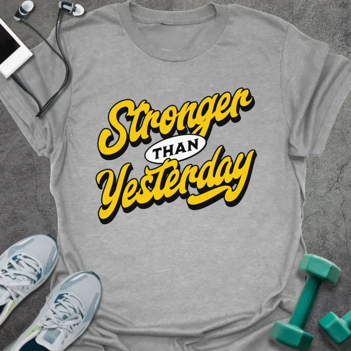 Sport grey t-shirt printed with "Stronger THAN Yesterday" in yellow