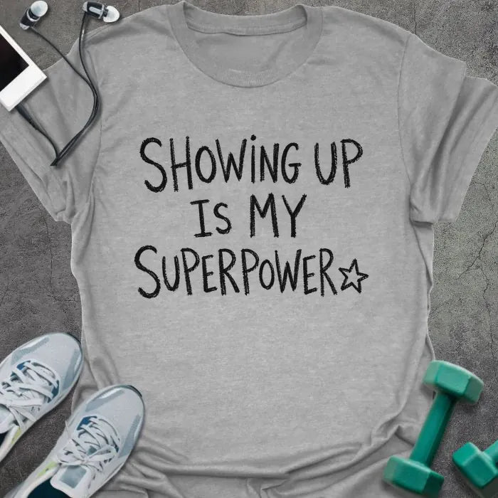 Sport Grey t-shirt printed with "SHOWING UP IS MY SUPERPOWER" in black handwritten lettering, with a star outline