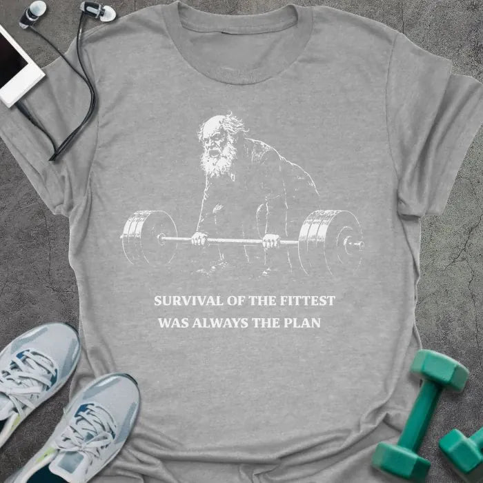 Sport grey t-shirt printed with "Survival of the Fittest Was Always the Plan" in white, with bearded figure lifting barbell graphic