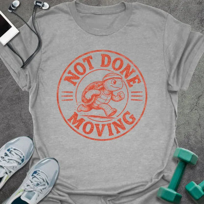 Sport Grey t-shirt printed with "NOT DONE MOVING" in coral, with running turtle in circle