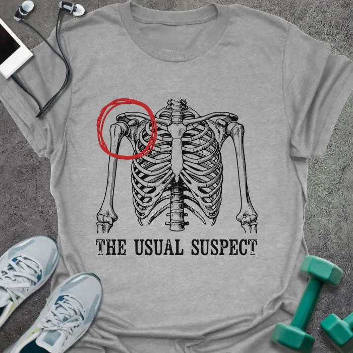 Sport grey t-shirt printed with "The Usual Suspect" in white and red, with a skeleton anatomy illustration highlighting the heart in red