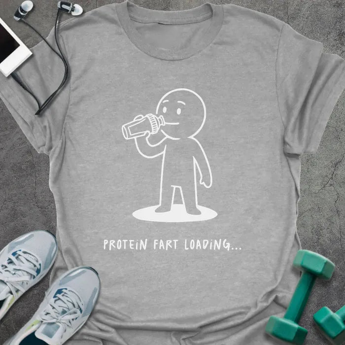 Sport grey t-shirt printed with "Protein Fart Loading...", with an illustration of a stick figure drinking protein