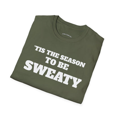 Folded military green t-shirt printed with "'TIS THE SEASON TO BE SWEATY" in white