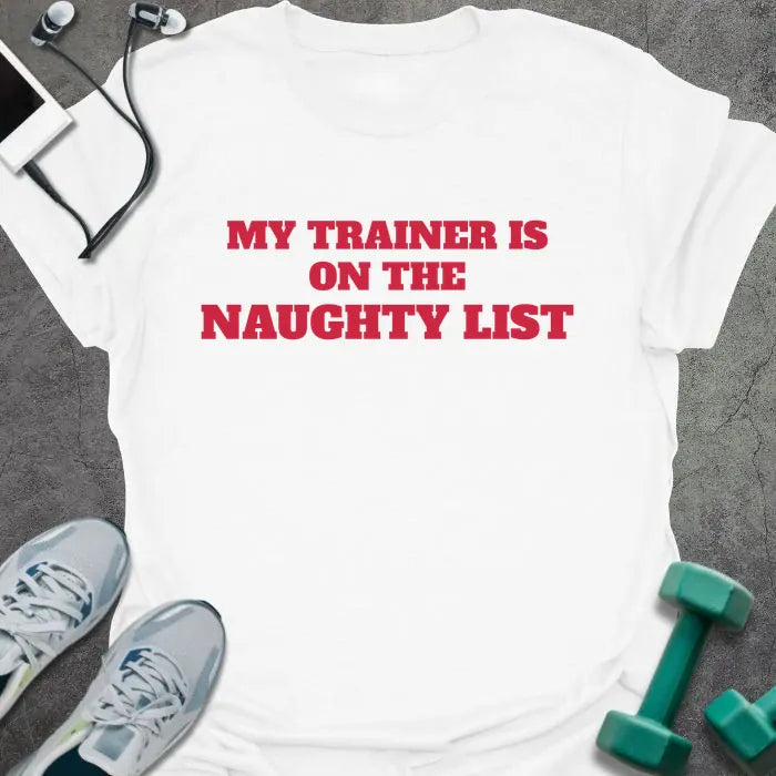 White t-shirt printed with "MY TRAINER IS ON THE NAUGHTY LIST" in red