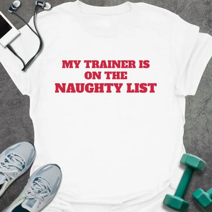 White t-shirt printed with "MY TRAINER IS ON THE NAUGHTY LIST" in red