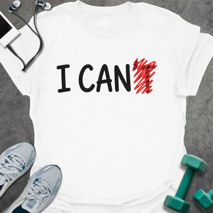 White t-shirt printed with "I CAN't" in black and red, with t crossed out