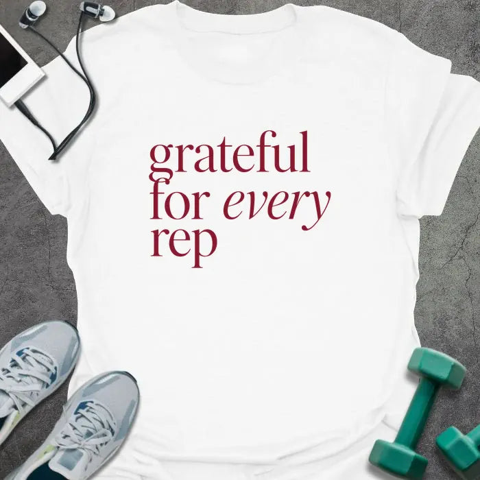 White t-shirt printed with "grateful for every rep" in burgundy
