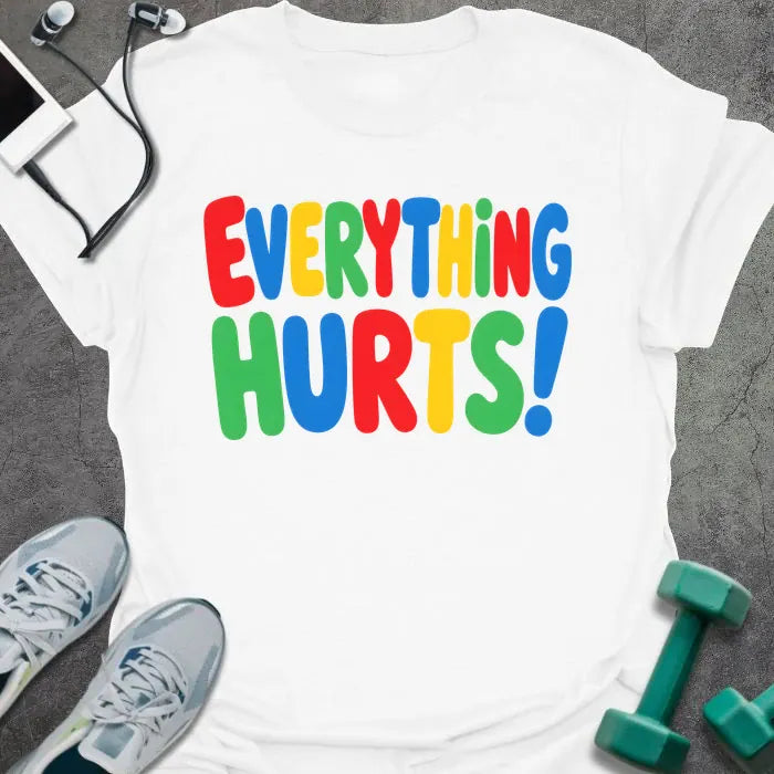 White t-shirt printed with "EVERYTHING HURTS!" in rainbow