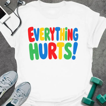 White t-shirt printed with "EVERYTHING HURTS!" in rainbow