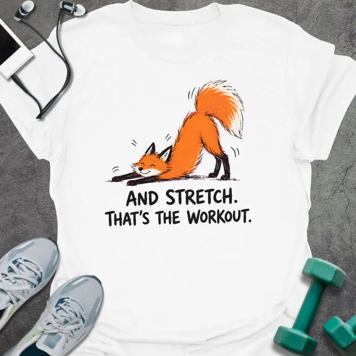 White t-shirt printed with "AND STRETCH. THAT'S THE WORKOUT." in black lettering, with a red fox in a stretching pose