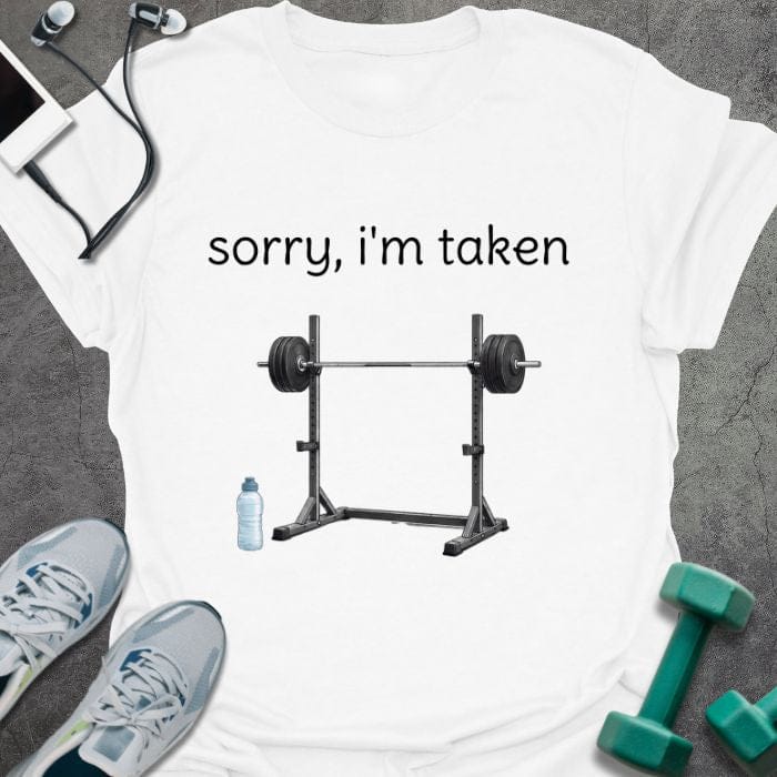 White t-shirt printed with "sorry, i'm taken", with a barbell with weights
