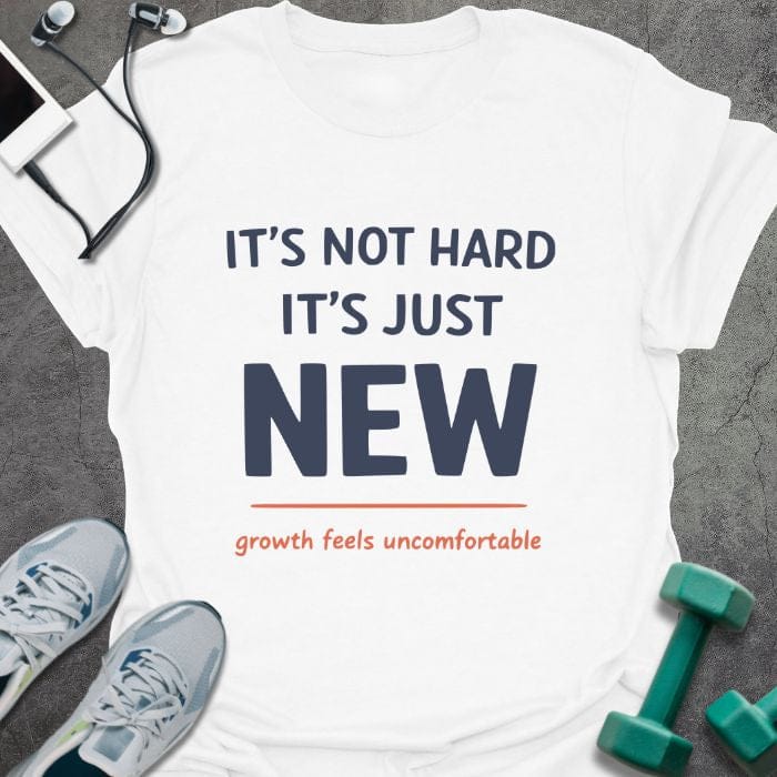 White t-shirt printed with "IT'S NOT HARD IT'S JUST NEW growth feels uncomfortable" in red