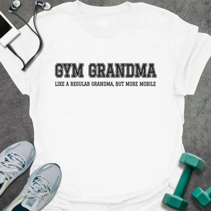White t-shirt printed with "GYM GRANDMA, LIKE A REGULAR GRANDMA, BUT MORE MOBILE" in charcoal varsity letters