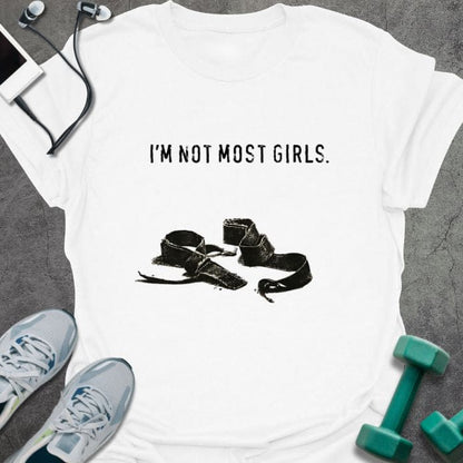 White t-shirt printed with "I'm Not Most Girls.", with lifting straps
