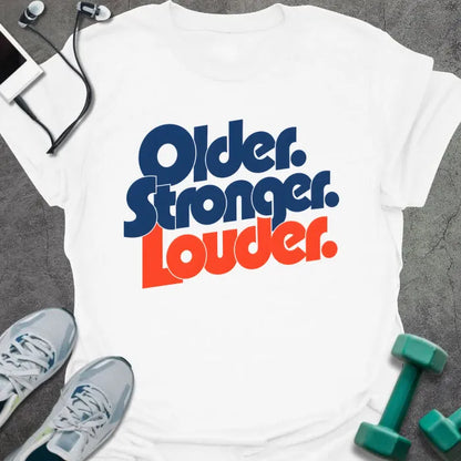 White t-shirt printed with "Older. Stronger. Louder." in navy blue with orange bold lettering