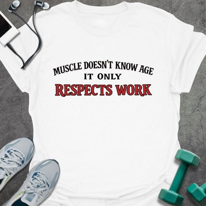 White t-shirt printed with "Muscle Doesn't Know Age it Only Respects Work" in red
