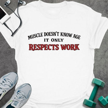 White t-shirt printed with "Muscle Doesn't Know Age it Only Respects Work" in red