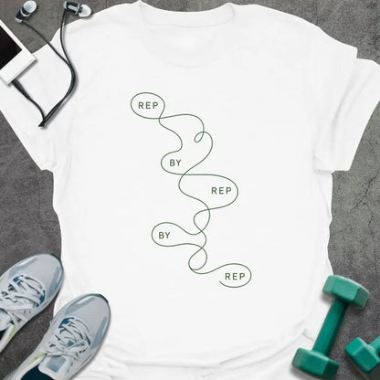White t-shirt printed with "REP BY REP BY REP" in green line art, with squiggle graphic