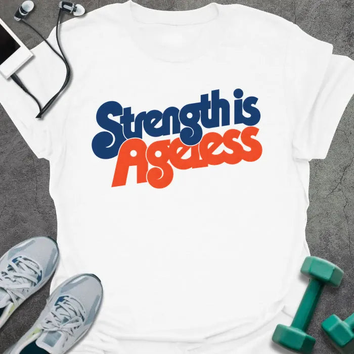 White t-shirt printed with "Strength is Ageless" in blue and red lettering