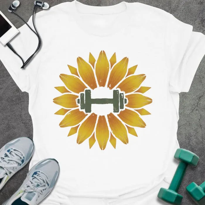 White t-shirt with an illustration of a sunflower surrounding a dumbbell in yellow and green