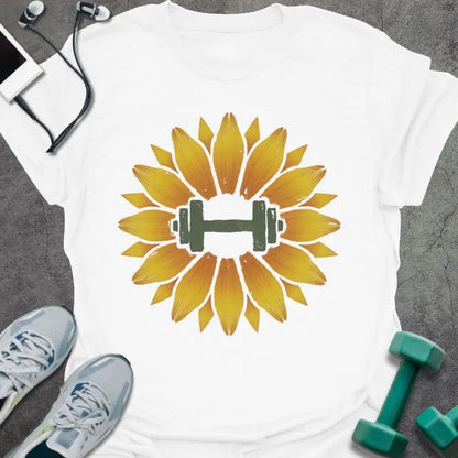 White t-shirt with an illustration of a sunflower surrounding a dumbbell in yellow and green