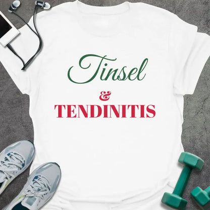 White t-shirt printed with "Tinsel & Tendinitis" in green and red