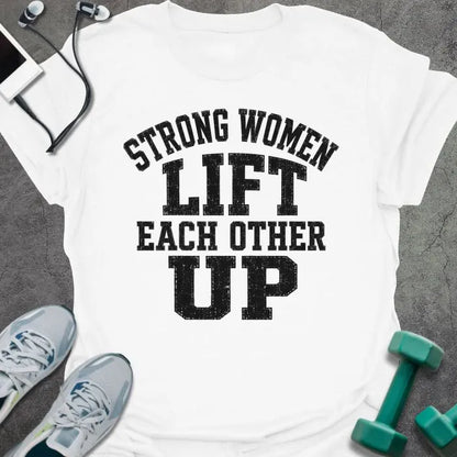 White t-shirt printed with "Strong Women Lift Each Other Up" in black varsity lettering