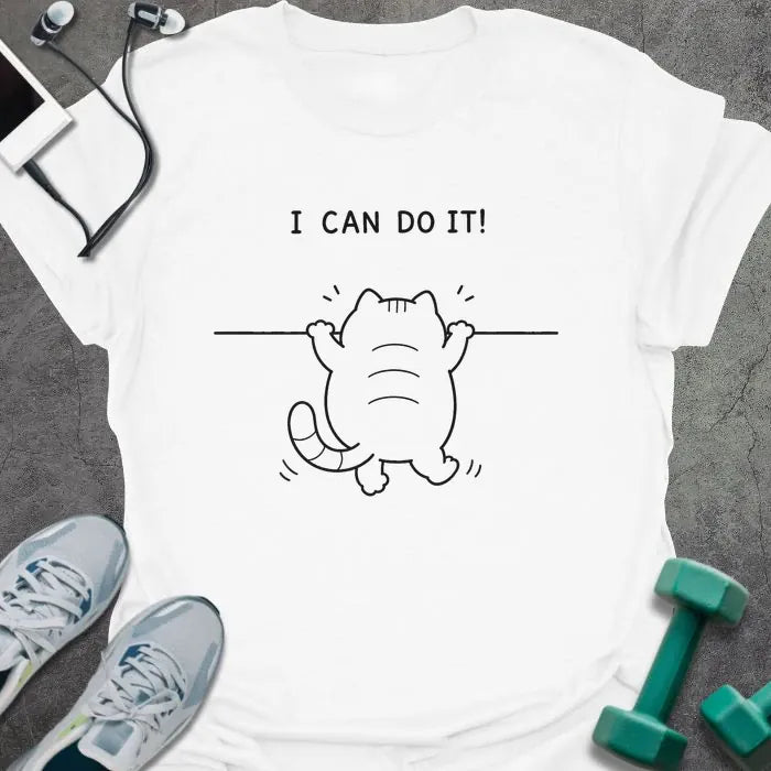 White t-shirt printed with "I CAN DO IT!" in black, with cat attempting pullup