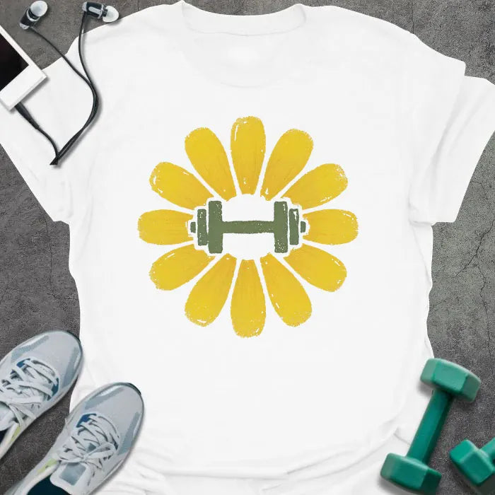 White t-shirt with an illustration of a dandelion flower surrounding a dumbbell in yellow and green