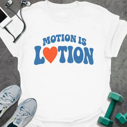 White t-shirt printed with "MOTION IS LOTION" in blue and orange, with heart icon