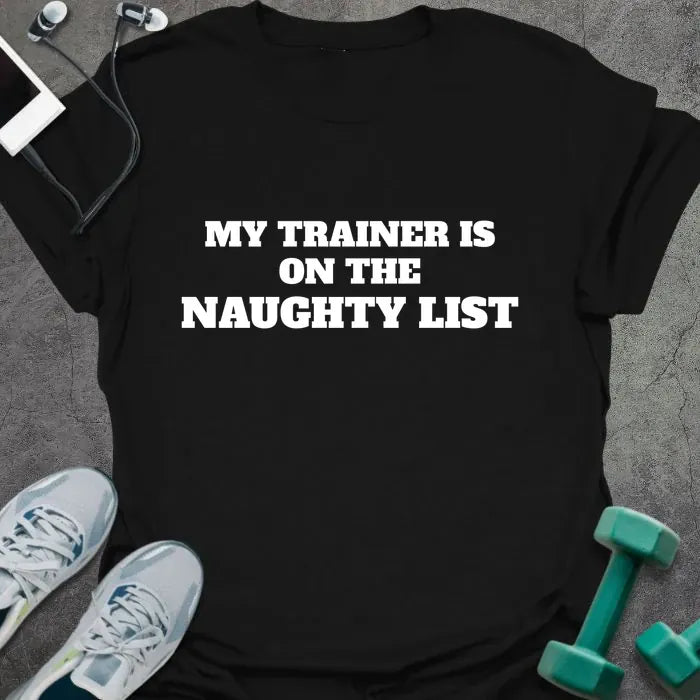 Black t-shirt printed with "MY TRAINER IS ON THE NAUGHTY LIST" in white