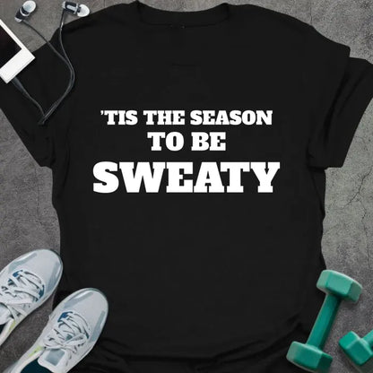 Black t-shirt printed with "'TIS THE SEASON TO BE SWEATY" in white