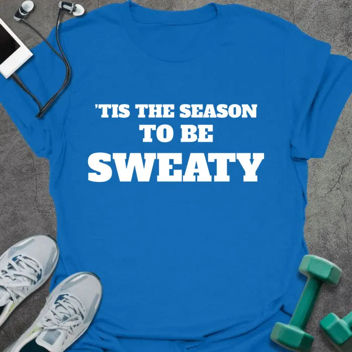 Royal blue t-shirt printed with "'TIS THE SEASON TO BE SWEATY" in white