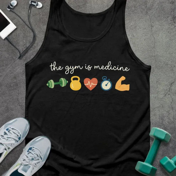 Black tank top printed with "the gym is medicine" in white, green, yellow, orange, and blue, with kettlebell, kettlebell, weight, heart, heartbeat, and bicep icons