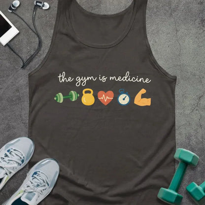 Dark grey tank top printed with "the gym is medicine" in white, green, yellow, orange, and blue, with kettlebell, kettlebell, weight, heart, heartbeat, and bicep icons