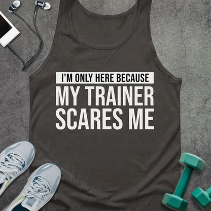 Dark grey tank top printed with "I'm Only Here Because my Trainer Scares Me" in white