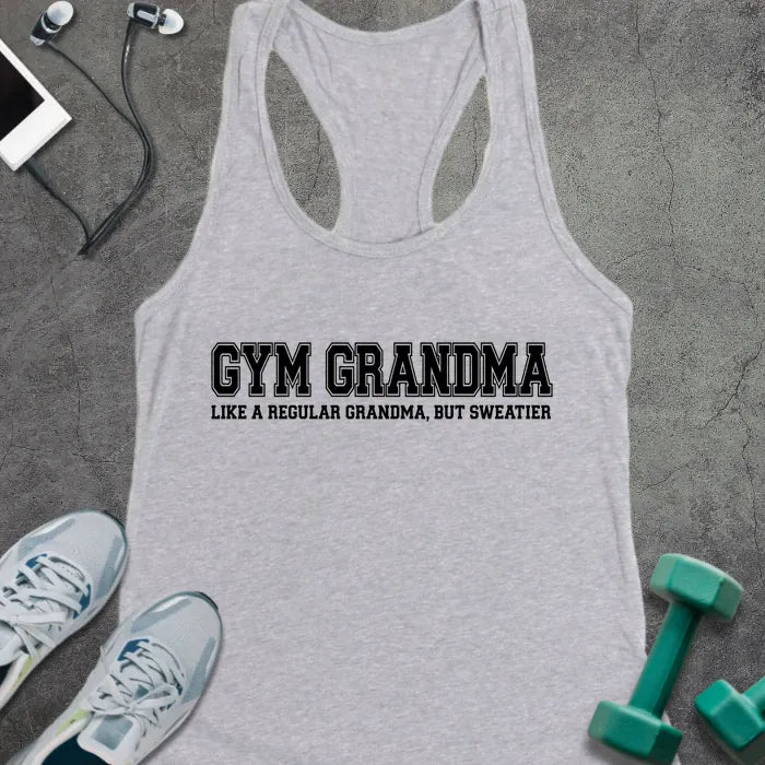 Heather grey racerback tank top printed with "GYM GRANDMA, LIKE A REGULAR GRANDMA, BUT SWEATIER" in black varsity letters