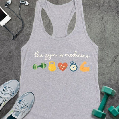 Heather grey tank top printed with "the gym is medicine" in white and multicolor, with colorful gym icons including dumbbells, kettlebell, heartbeat, and flexed arm