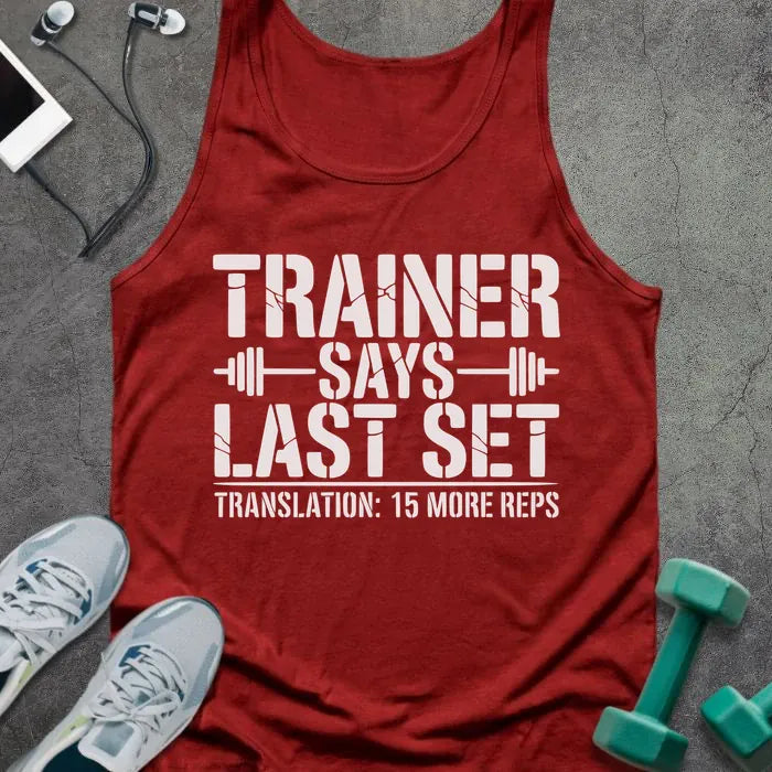 Red tank top printed with "Trainer Says Last Set Translation: 15 More Reps" in white