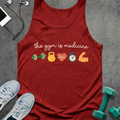 Red tank top printed with "the gym is medicine" in white, green, yellow, orange, and blue, with kettlebell, kettlebell, weight, heart, heartbeat, and bicep icons